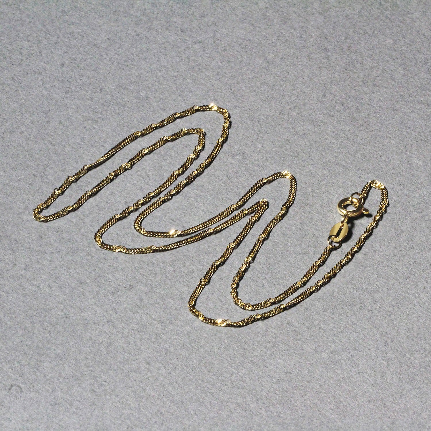 10k geelgouden Singapore-ketting (1,50 mm)
