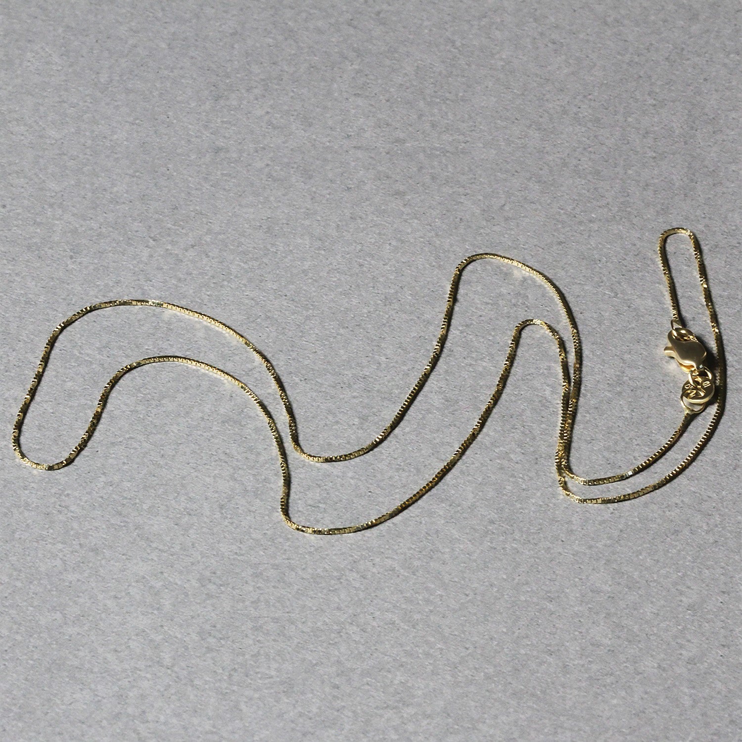 Chaîne classique en or jaune 14 carats (0,60 mm)