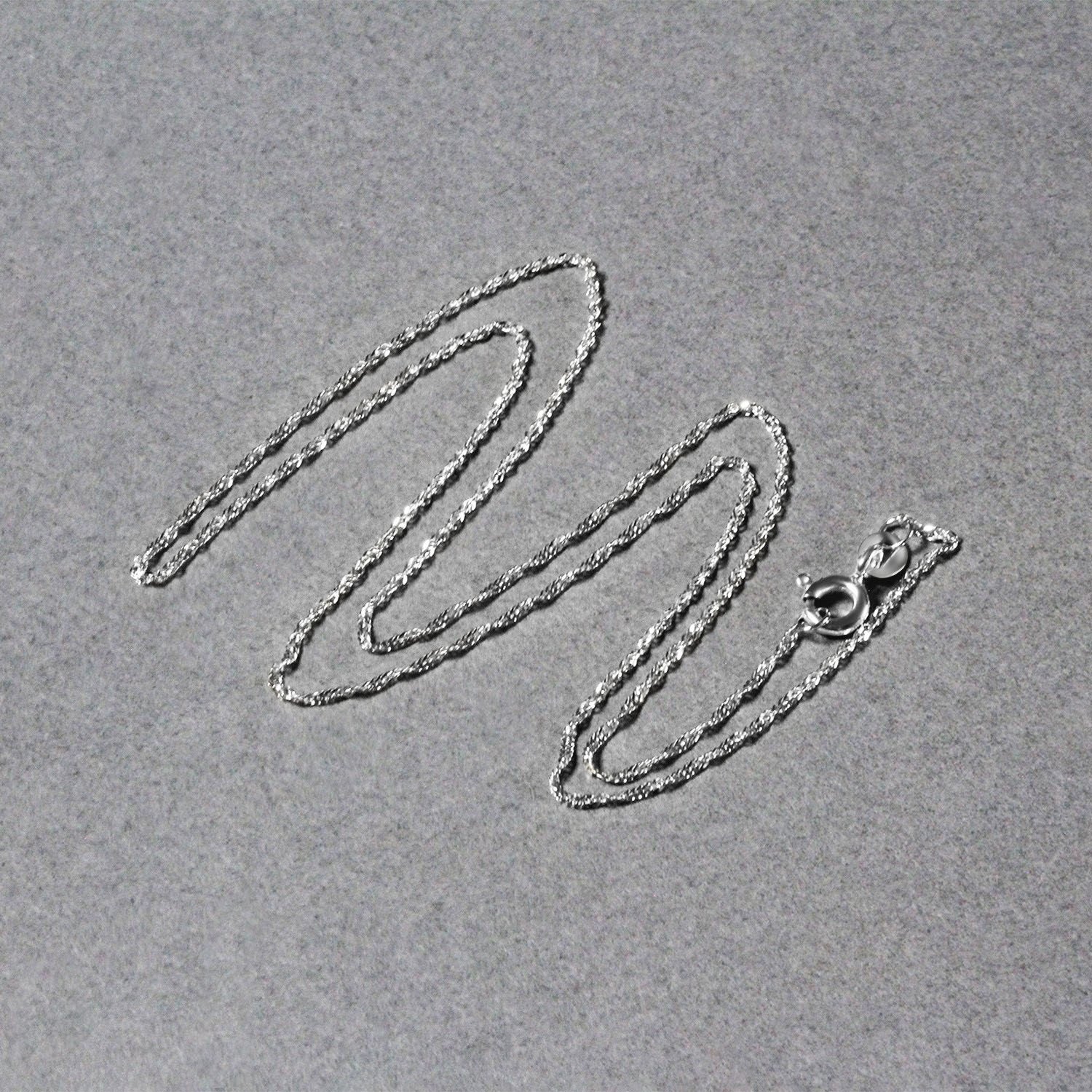 Chaîne Singapour en or blanc 14 carats (1,10 mm)